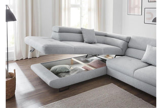 Gray sectional sofa with storage drawers in a living room setting