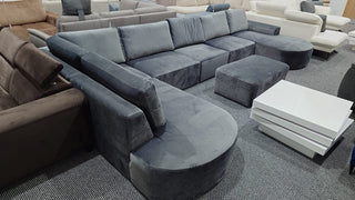 Sofa narożna Tomino U XL z ekspozycji z podnóżkiem Malta Cosmic