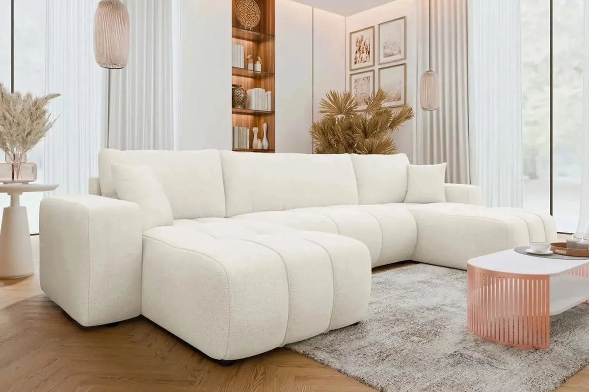 White sectional sofa in a modern living room with decor elements.